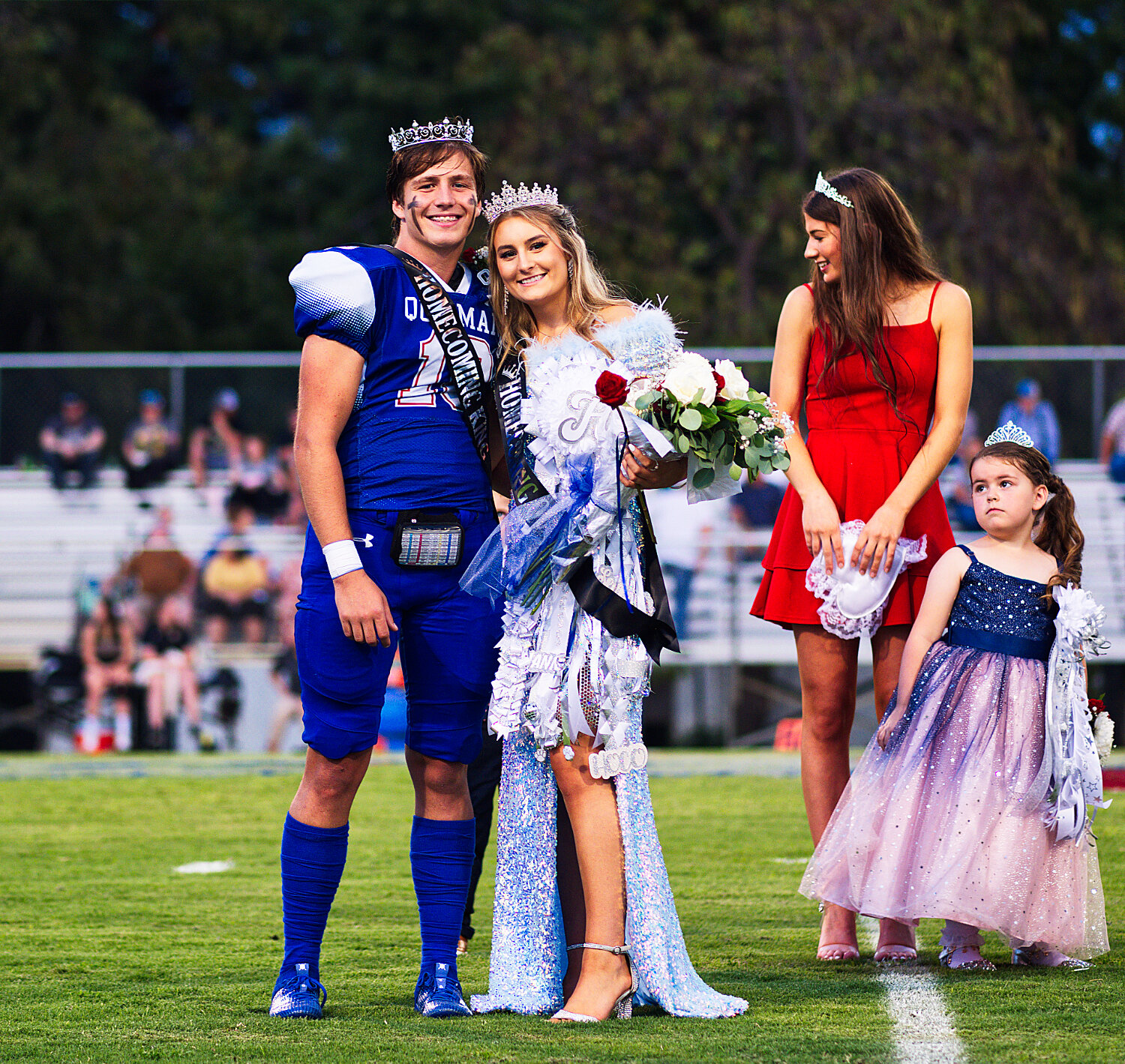 Newly-crowned 2023 Quitman homecoming king and queen Mikey Pickering and Hannah Holland after being crowned by the previous queen, Kameran Farnham, and attendant Sawyer Osbourn. [see more sights & buy Bulldogs prints]